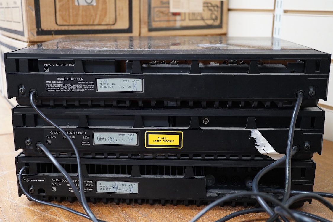 A Bang and Olufsen 6500 hi-fi system, comprising of a Beocord 6500, a Beogram CD 6500, a Beomaster 6500, and a master control panel, together with a pair of floor standing pedestal speakers, 164cm high, and pair of type